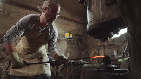 Senior-Blacksmith-Working-with-Power-Hammer-Machine